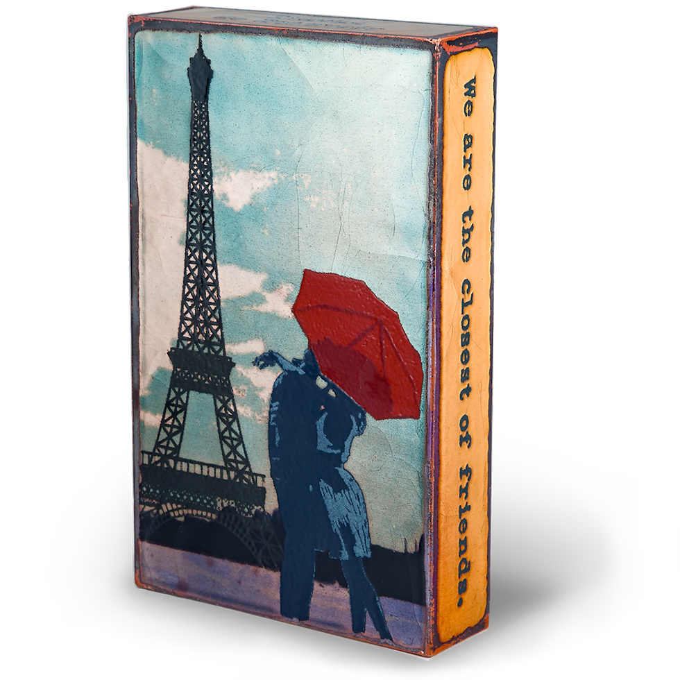 Thumbnail: Paris book cover with Eiffel Tower and couple under red umbrella. We Are The Element