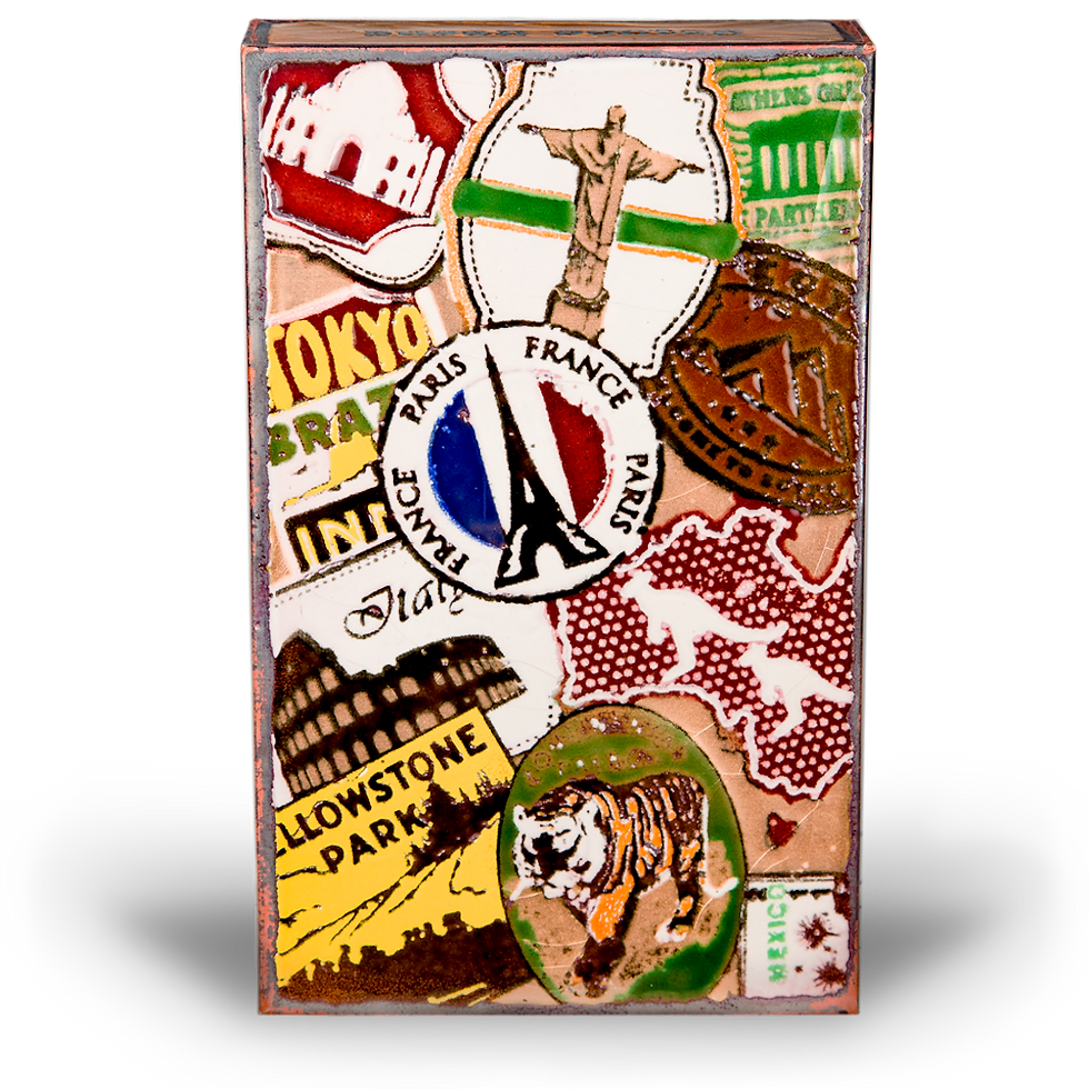 Thumbnail: Box with various travel stickers, Tokyo, Paris, France, and Yellowstone Park. 176 - Groove.