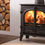 Thumbnail: Stovax Stockton 5 Wide Wood burning stove next to log storage in wall