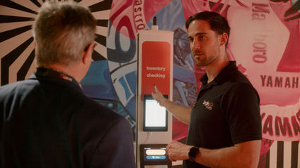 Event photographer — product demonstration at an exhibition booth, by Theo Solnik