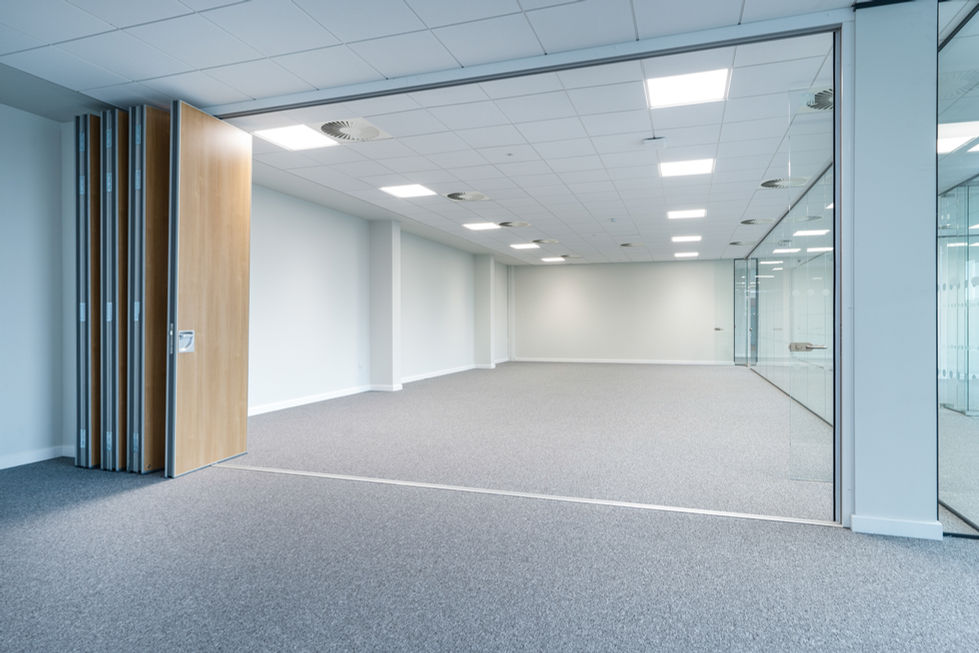 Open-plan office space with movable timber partition wall and glazed meeting rooms