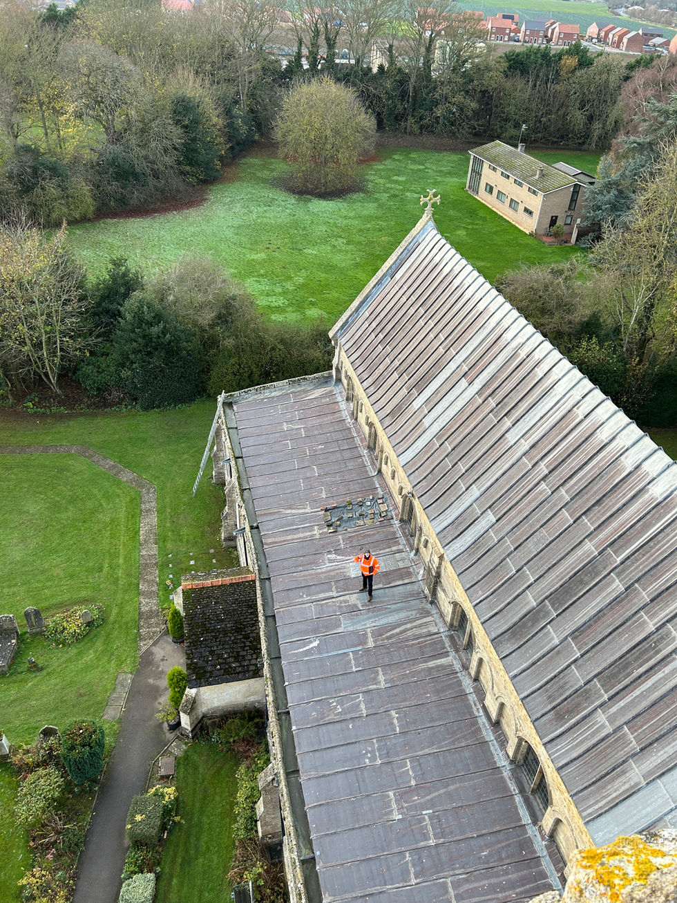 Roof level survey work at St Mary’s Church, Whaplode, on the aisle roof during inspection and scanning works