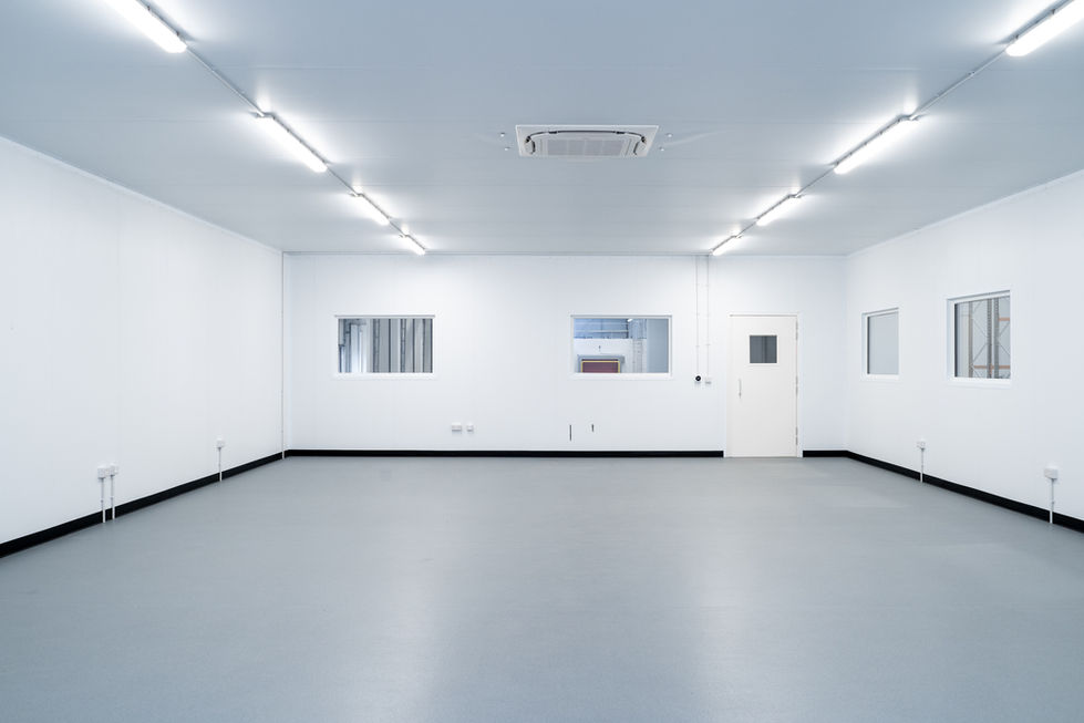 Clean internal room with observation windows and controlled access door