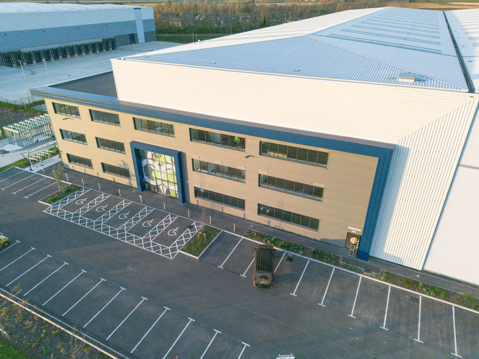 Aerial view of warehouse office frontage with parking and glazed entrance