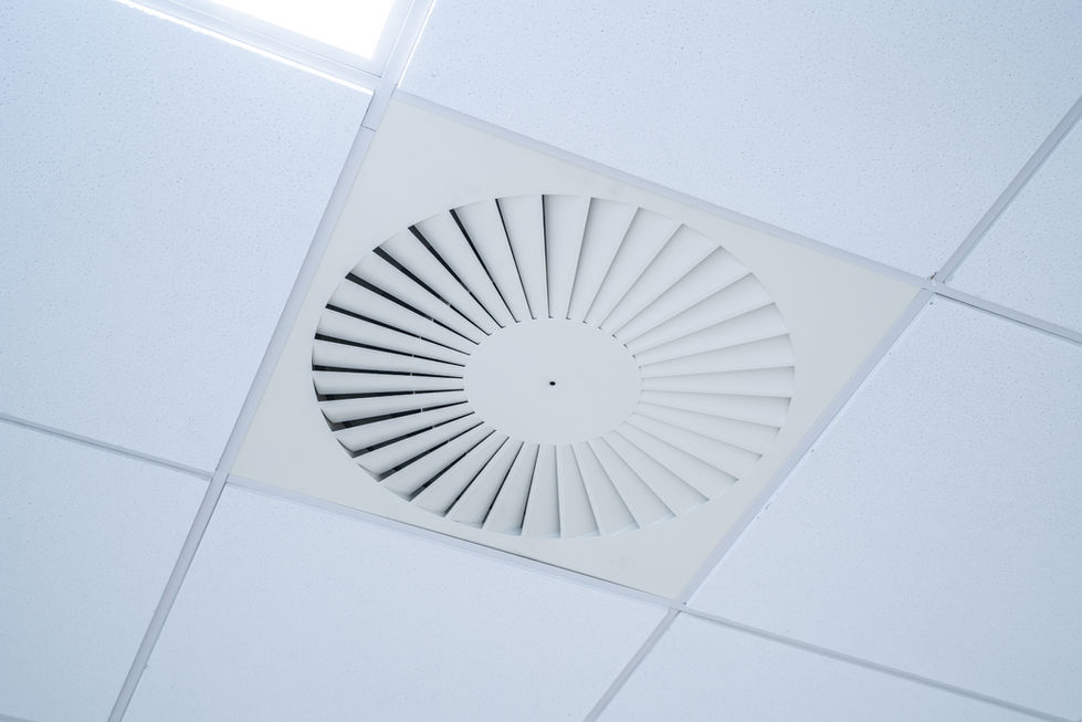 Ceiling diffuser detail within suspended office ceiling grid