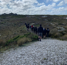 People walking a track on the West Coast of Tasmania