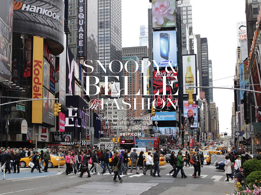 Snoopy and Belle in fashion logo on top of billboards in Times Square