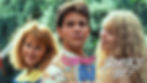 three high school students posing front of a tree