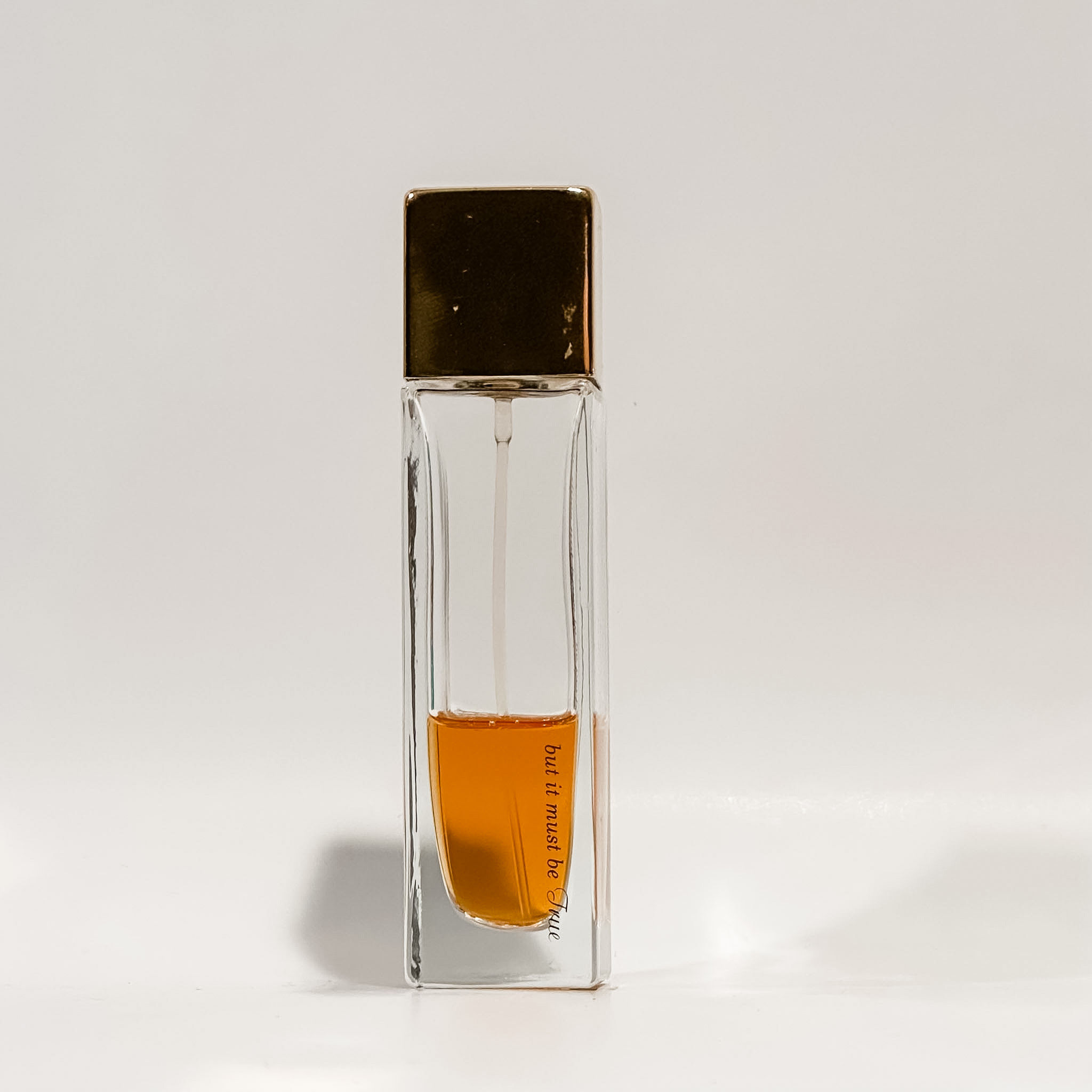 Love Everywhere fragrance spray bottle with gold-tone cap