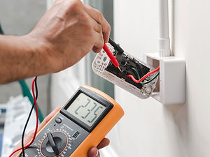 electrician-is-using-digital-meter-measure-voltage-power-outlet.jpg