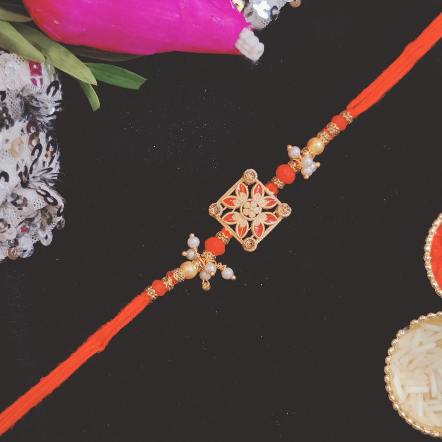Designer Rakhi with Flower Motif & White Moti Beads