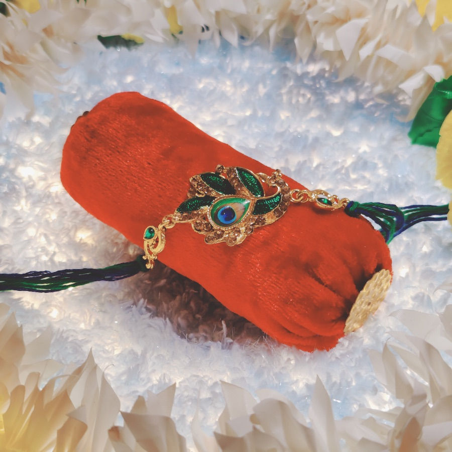 Thumbnail: Designer Rakhi with Peacock & feather Pendant