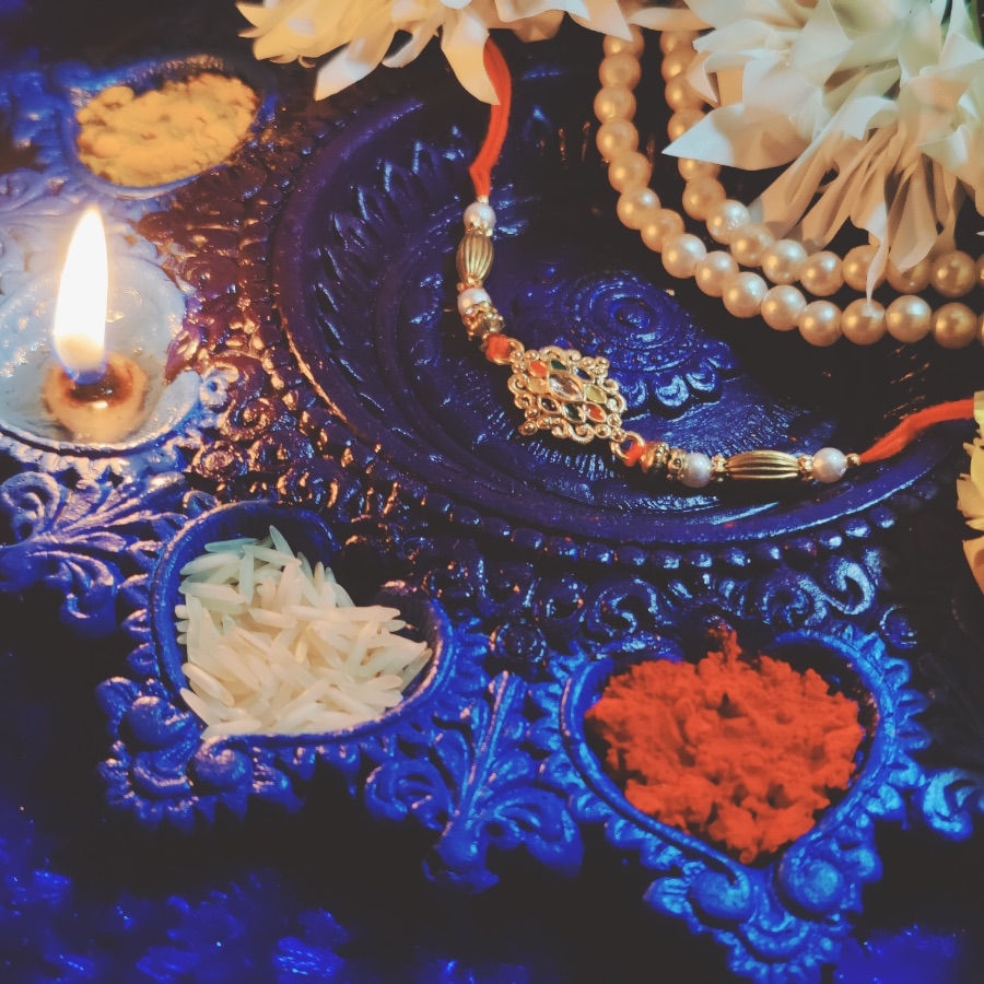 Thumbnail: Kundan Work Eleptical Shape Pendant Rakhi