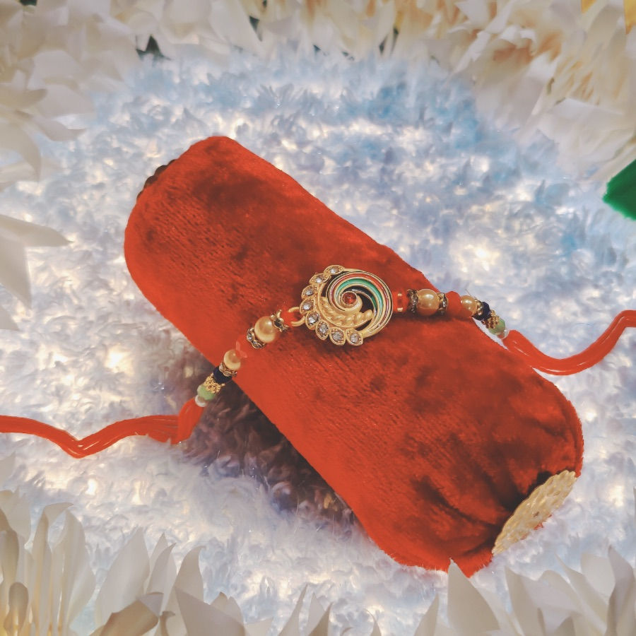 Thumbnail: Designer Peacock Theme Rakhi with Pearl Beads