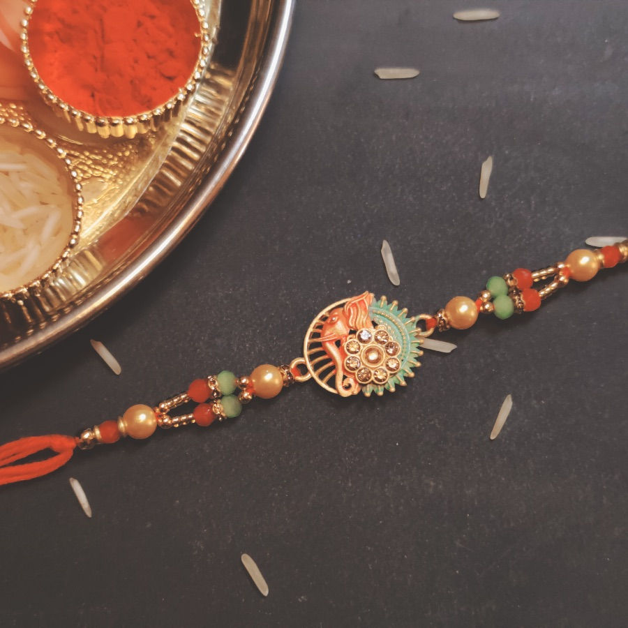 Designer Rakhi with Lord Ganesh & Sun Pendant
