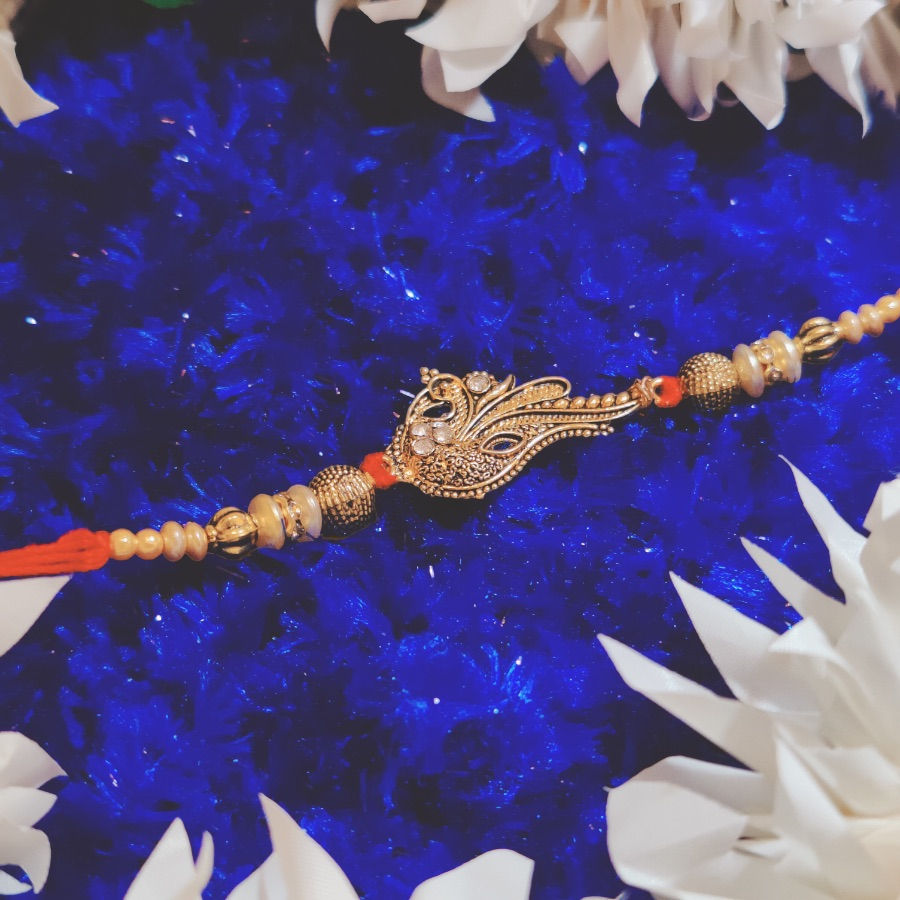 Thumbnail: Peacock Golden Pendant Rakhi with Beads