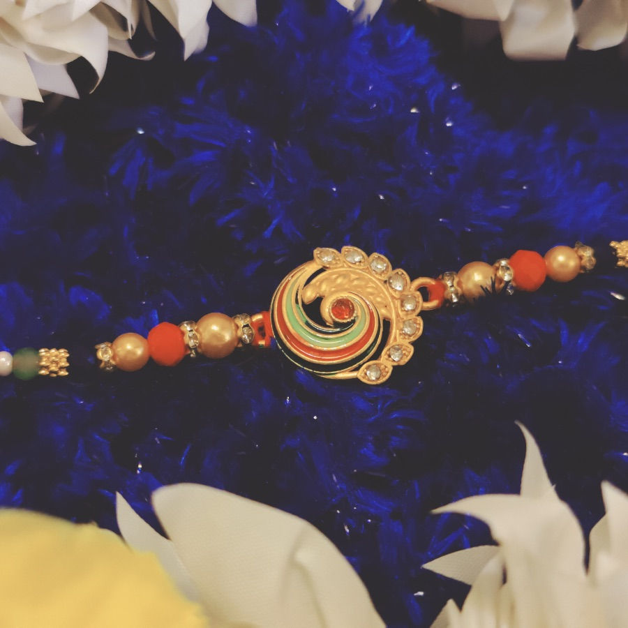 Thumbnail: Designer Peacock Theme Rakhi with Pearl Beads