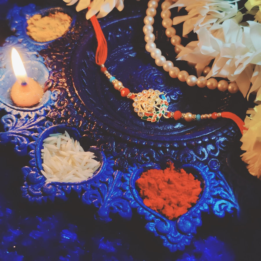Thumbnail: Designer Rakhi with Ganesh & Peacock Pendant