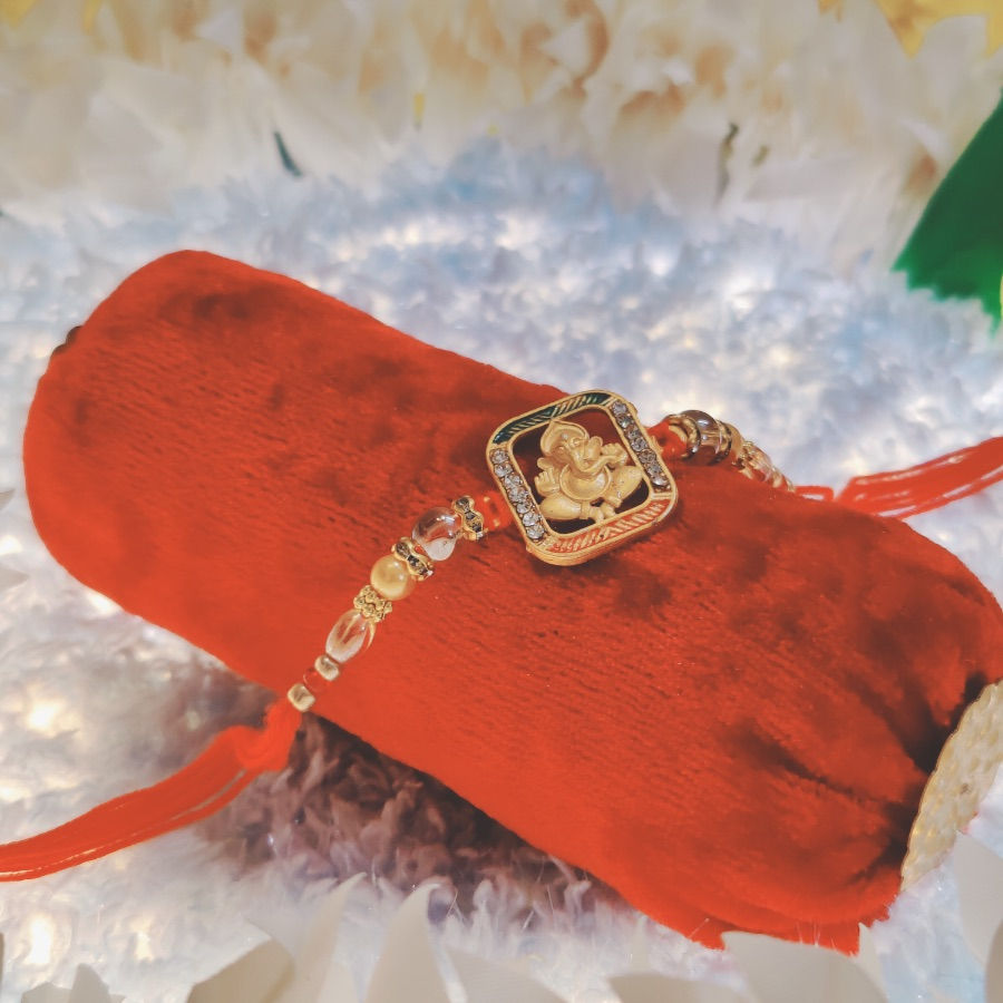 Thumbnail: Designer Rakhi with Lord Ganesh in Rectangle Pendant