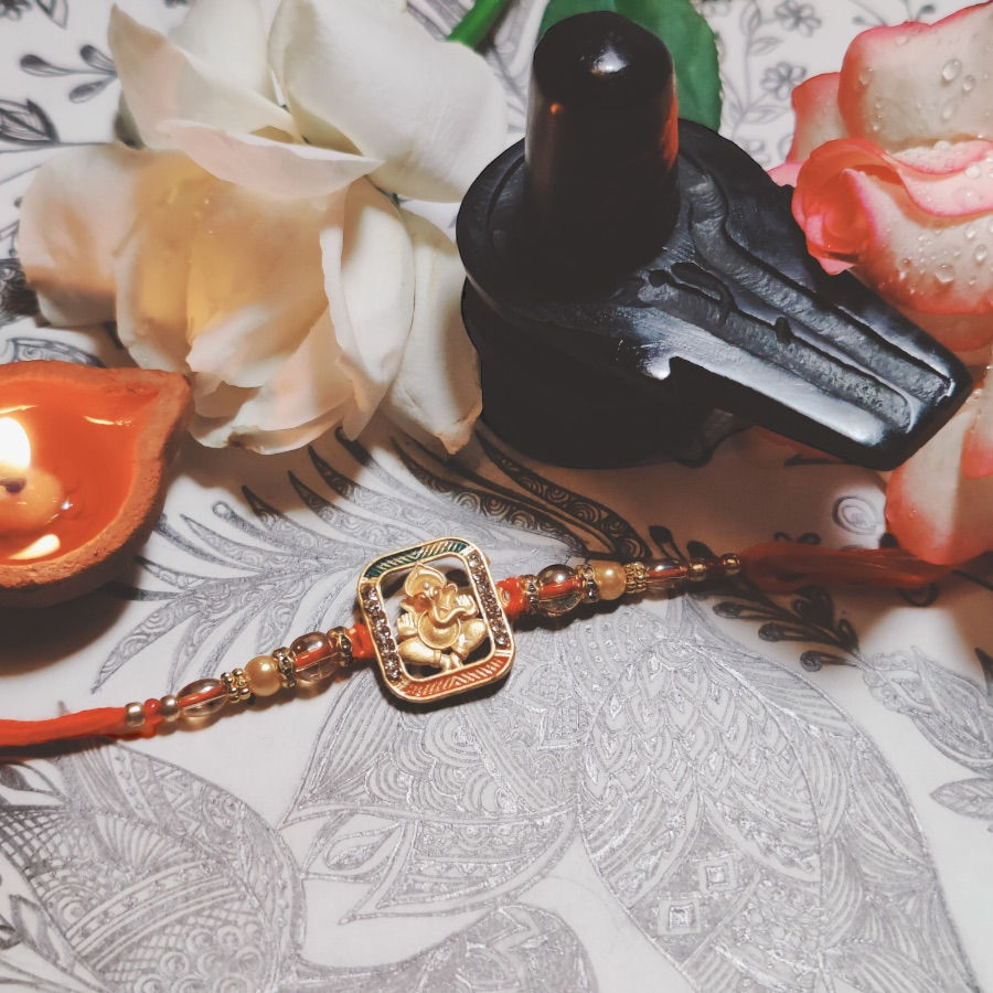 Designer Rakhi with Lord Ganesh in Rectangle Pendant