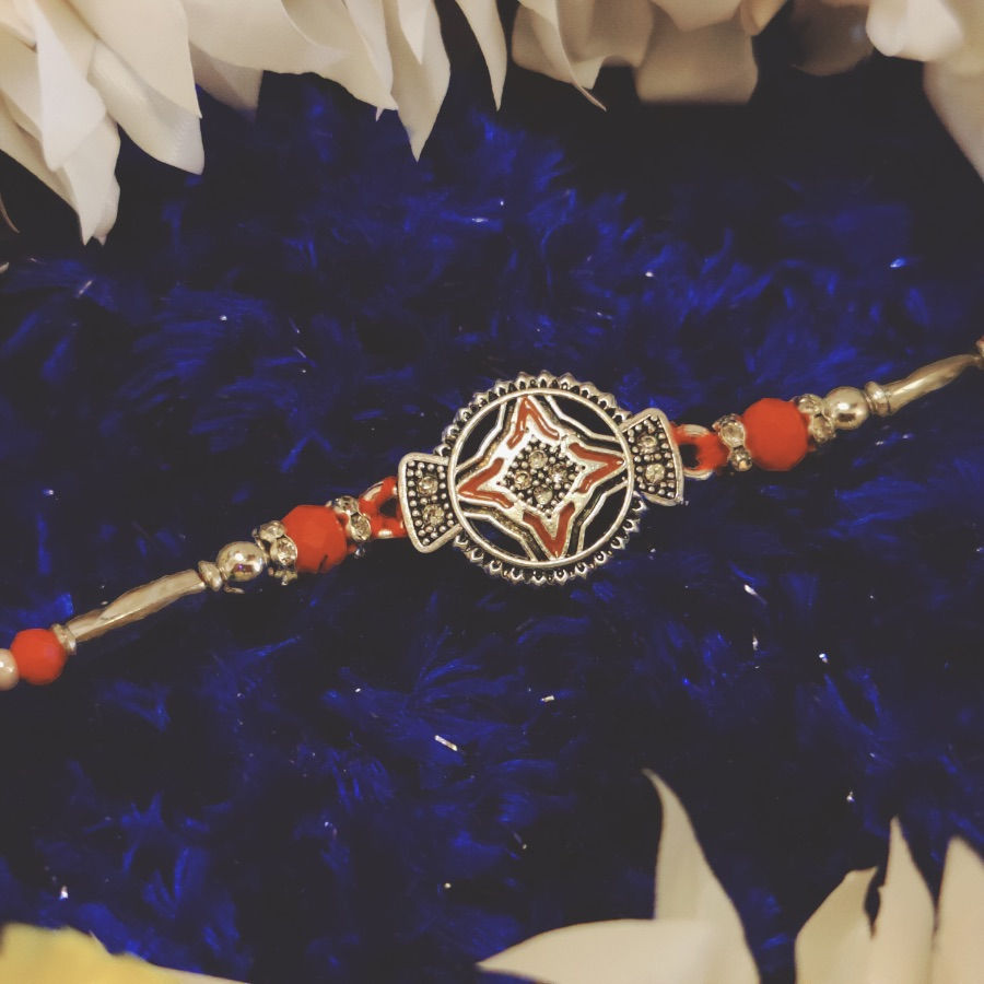 Thumbnail: Silver Design Rakhi with Red Pearl Beads