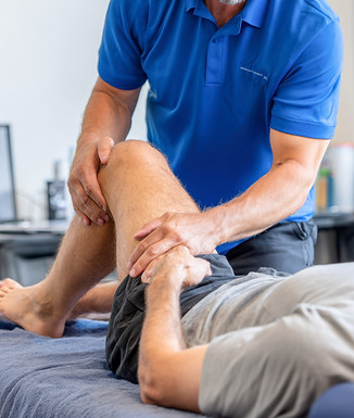 vecteezy_physiotherapist-providing-leg-rehabilitation-therapy-during_71138236.jpg