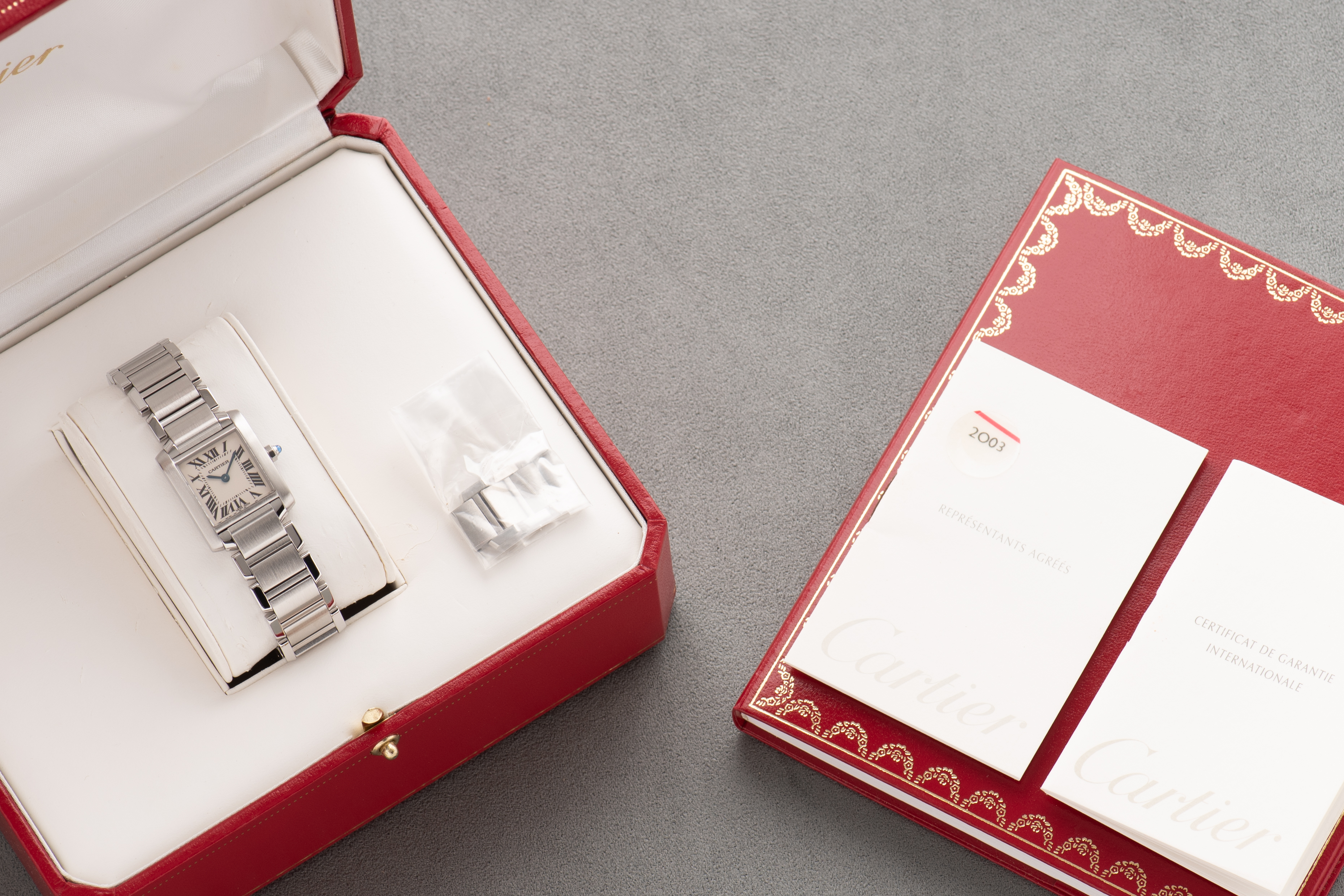 View of Cartier Tank Française SM Roman Dial Réf 2384 Full Set from 2000