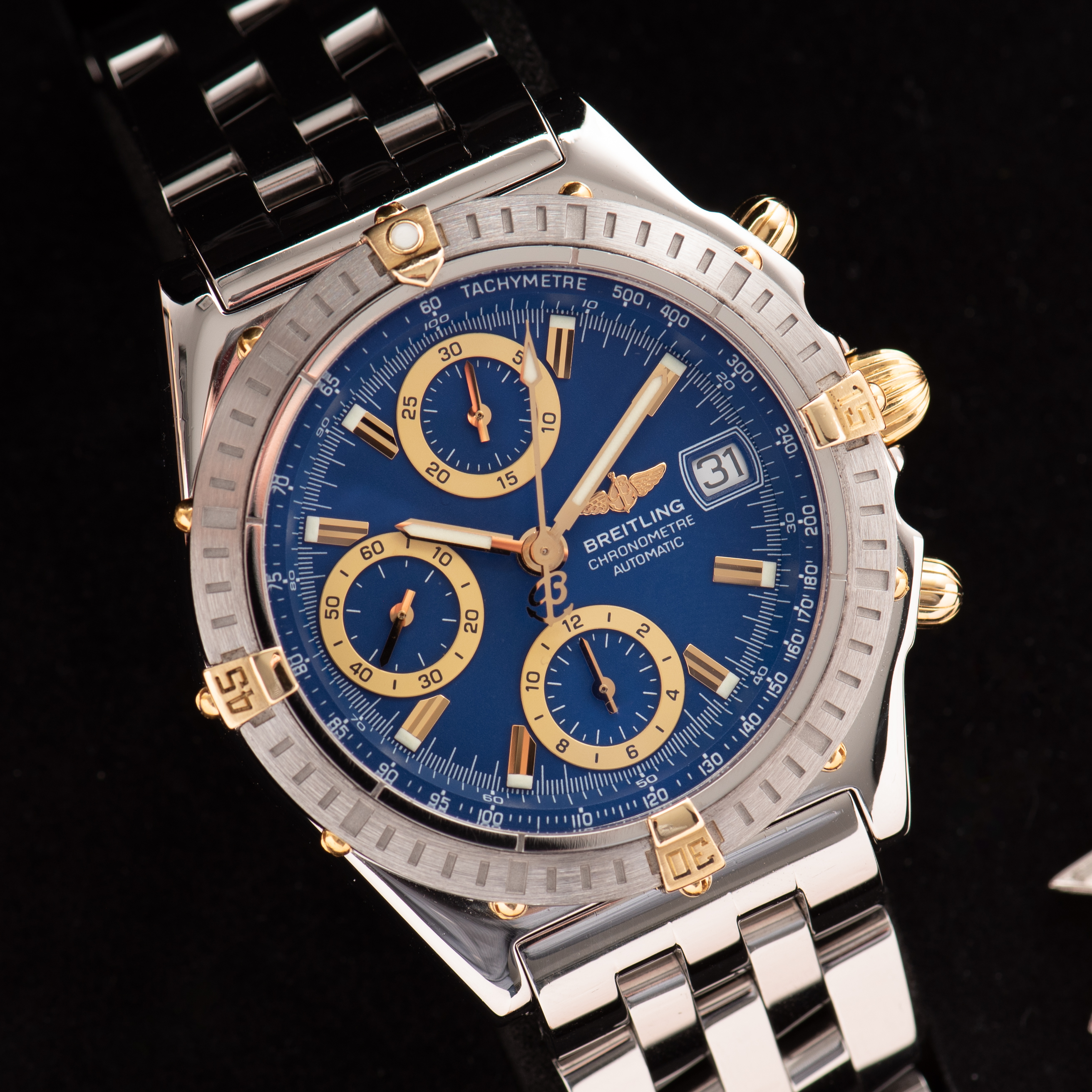 View of Breitling Chronomat Gold/Steel Chronograph Blue dial Réf D13352 FULL SET