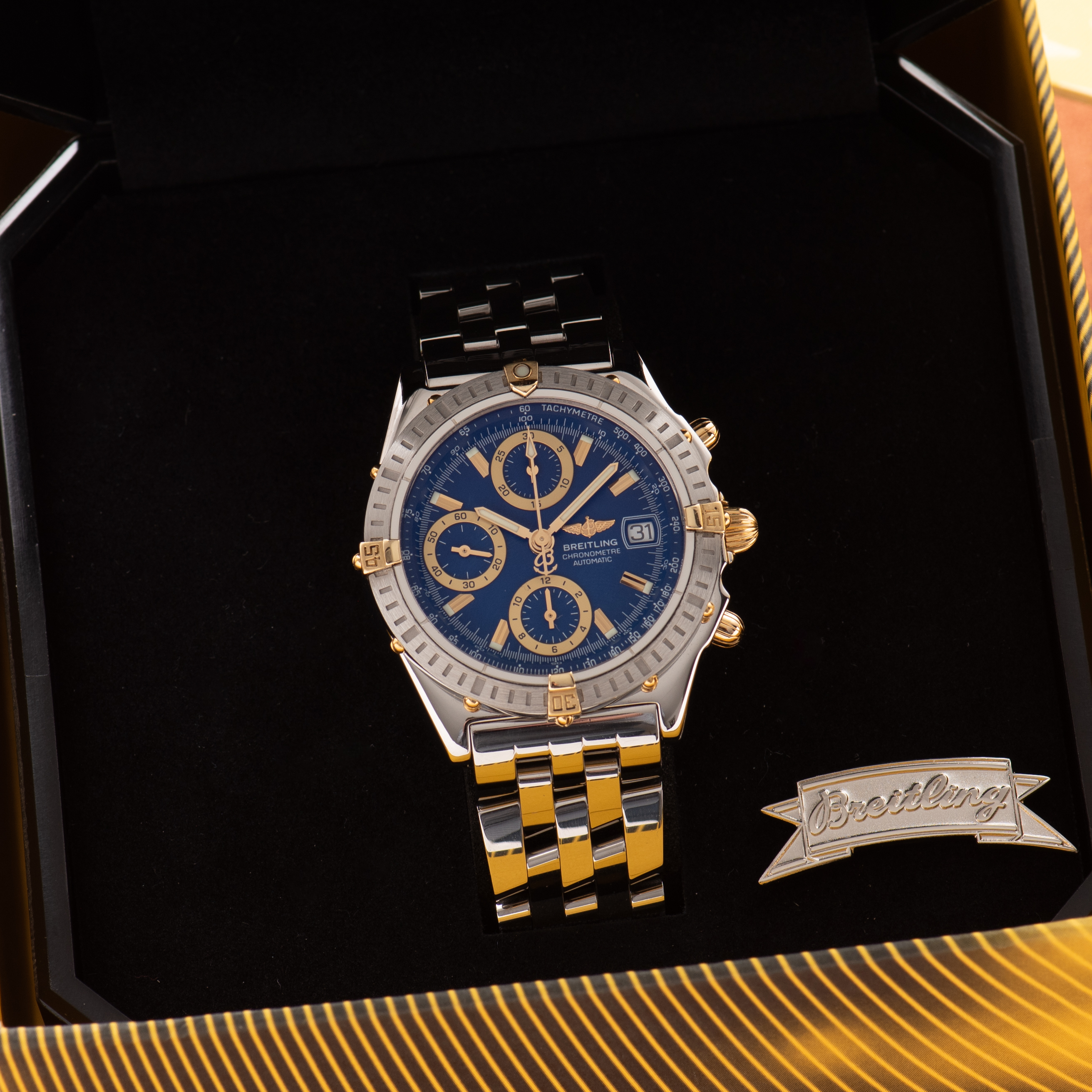 View of Breitling Chronomat Gold/Steel Chronograph Blue dial Réf D13352 FULL SET