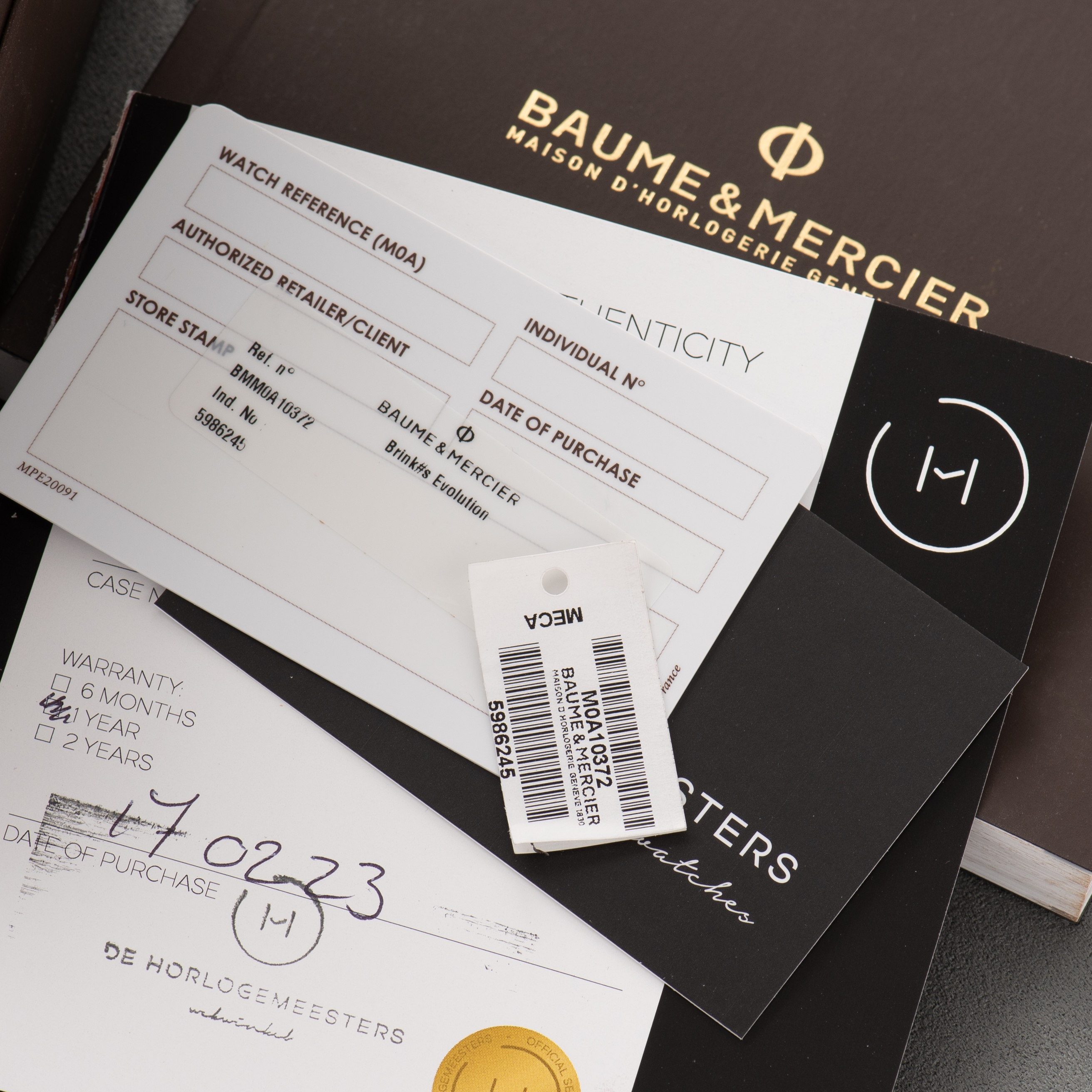 Zicht op Baume & Mercier Genève Clifton Racing Club Chronographe réf M0A10372 Full Set