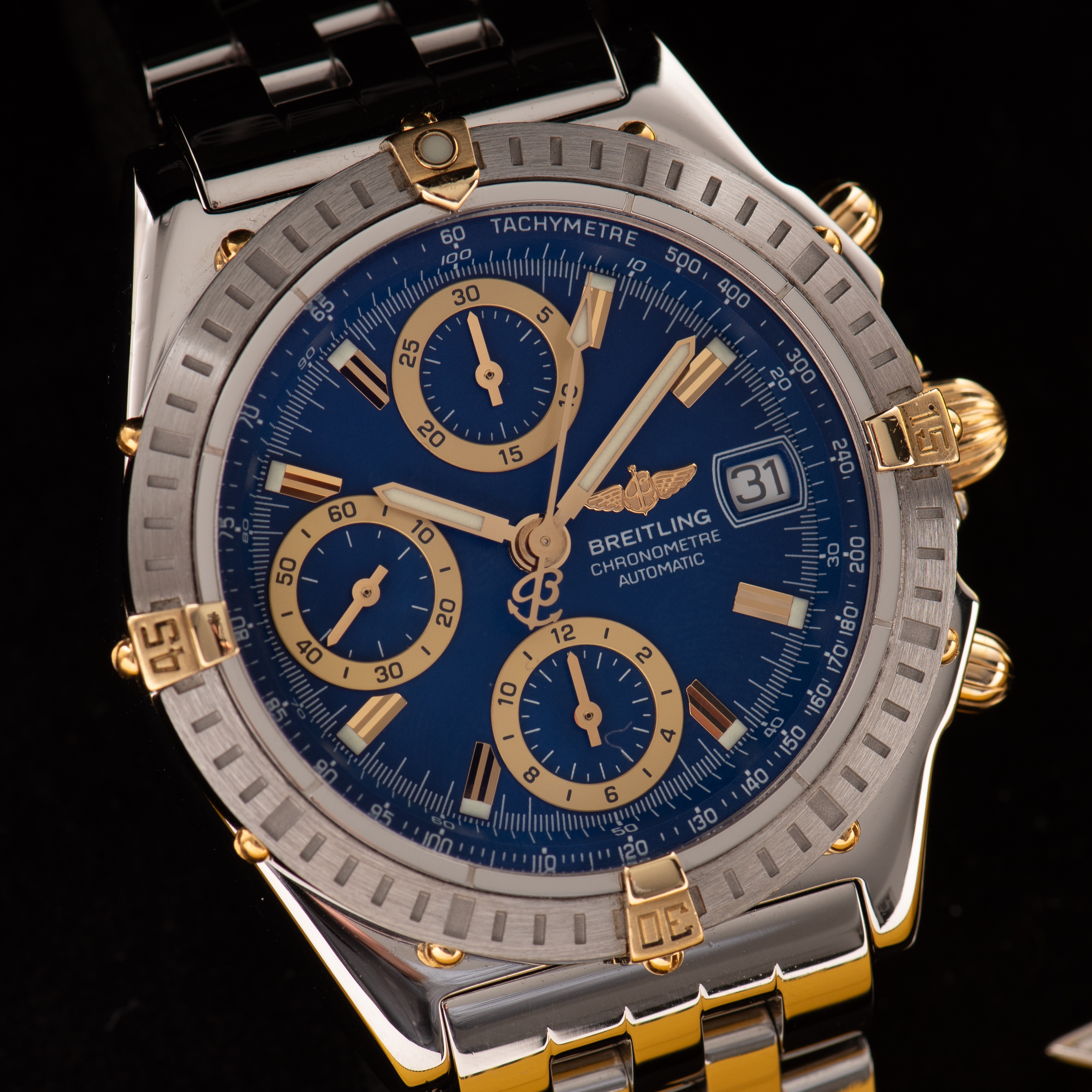 View of Breitling Chronomat Gold/Steel Chronograph Blue dial Réf D13352 FULL SET