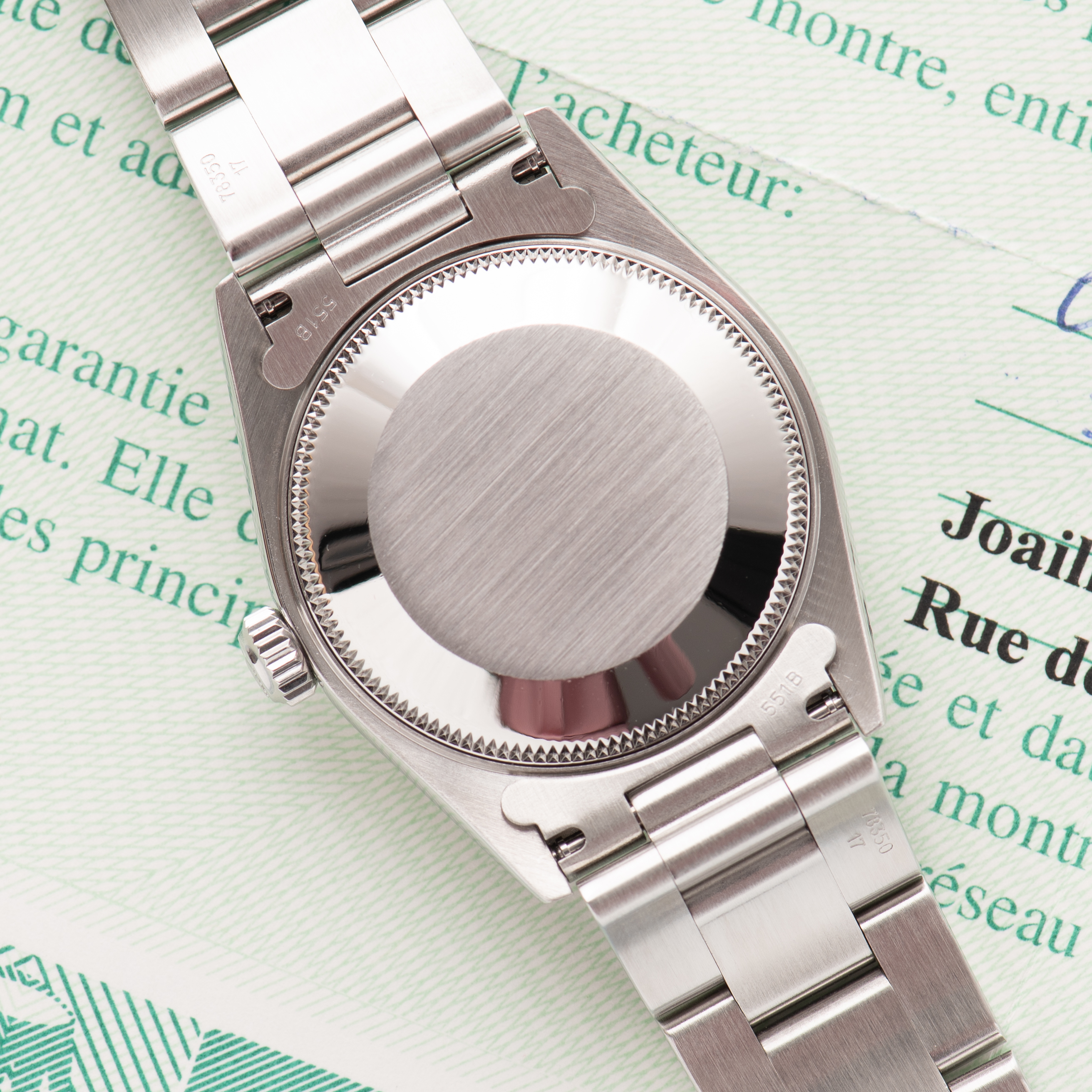 Zicht op Rolex Oyster Perpetual Silver Dial Réf 77080 Full set from 2005