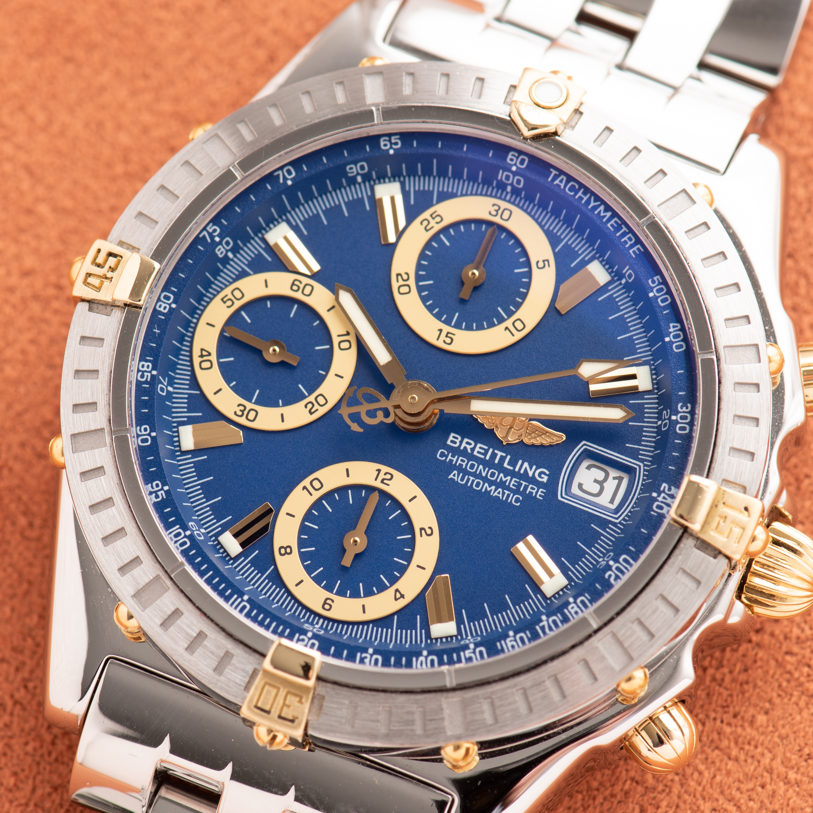 View of Breitling Chronomat Gold/Steel Chronograph Blue dial Réf D13352 FULL SET