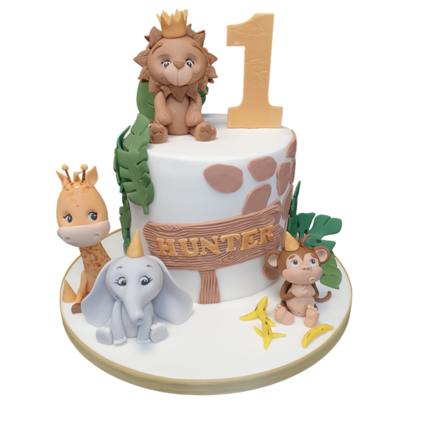 Adorable animal-themed cake with colorful fondant decorations on a white icing base, perfect for a children's party or animal lover celebration.