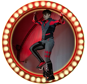 Harlequin Grim on tall unicycle in lightbulb frame