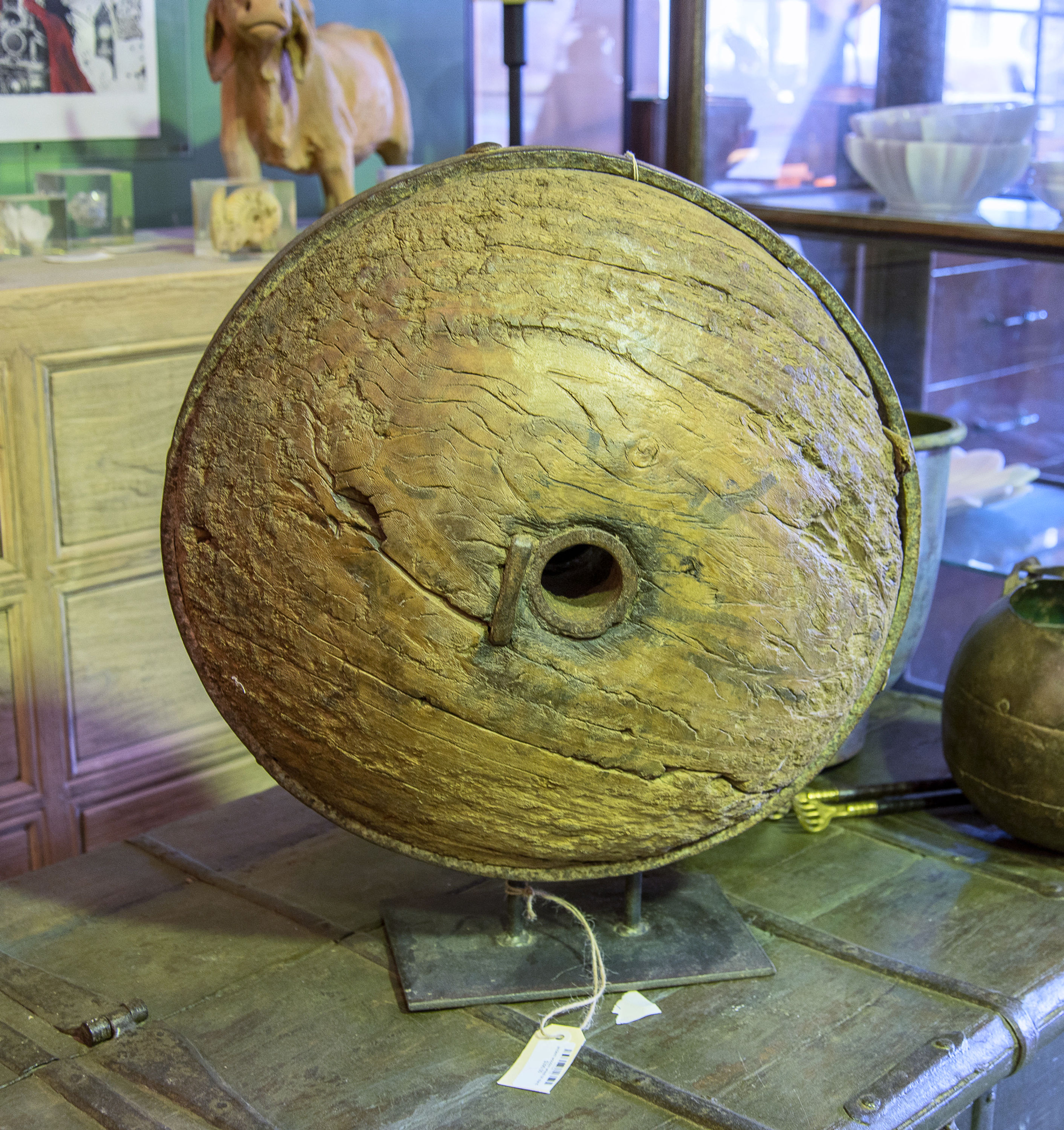 ancient wooden wheel on stand