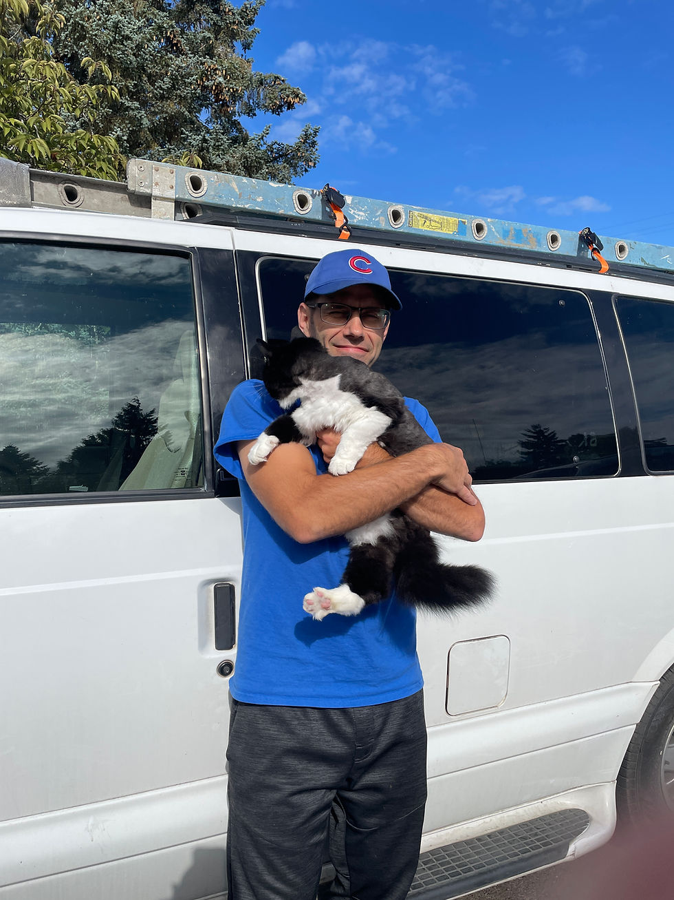 Harley holding his cat