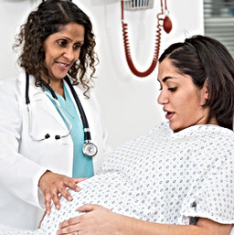 Doctor examining pregnant patient