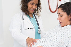Doctor examining pregnant patient
