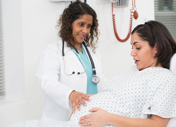 Doctor examining pregnant patient