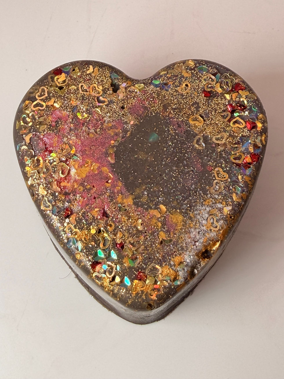 Heart Breaker galaxy heart wax melt with colorful glitter on white background”