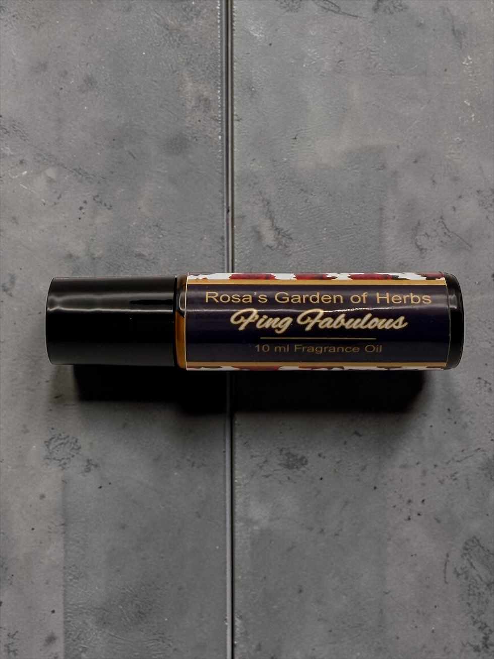 F’ing Fabulous fragrance oil roller 10 ml bottle on gray surface with teal background