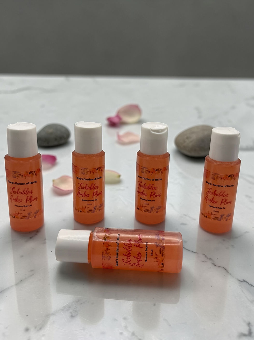 Thumbnail: Forbidden Amber Plum Shimmer Body Oil 59ml bottle with radiant glow finish for soft, luminous skin