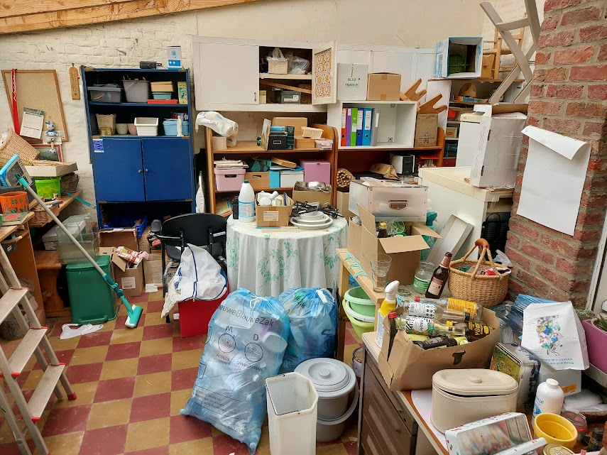 Cluttered storage room with many items, landscape photo