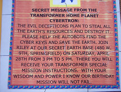 Close-up photo of completed puzzle invite for Transformer Party