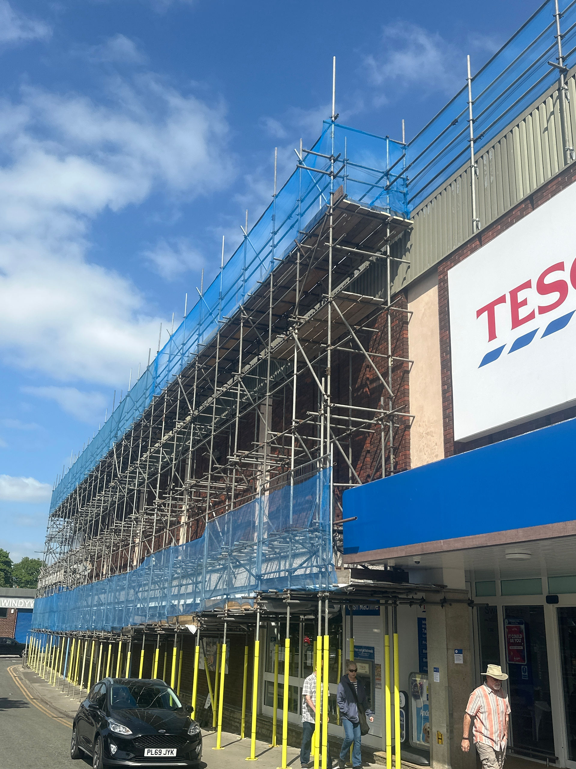 Scaffolding for RAAC roof replacement on supermarket