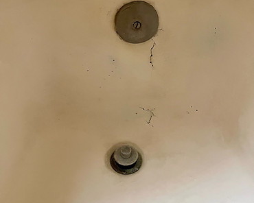 Crack on side wall of fiberglass tub before repair