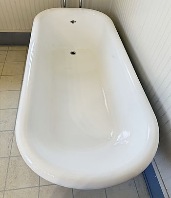 White bathtub after professional reglazing and refinishing