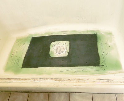 Fiberglass shower floor rebuilt and reinforced before refinishing