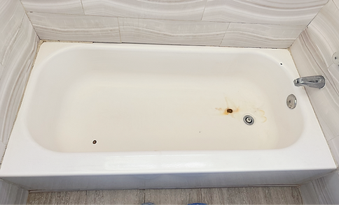 Worn porcelain bathtub before reglazing